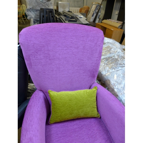 1577 - An amethyst fabric armchair