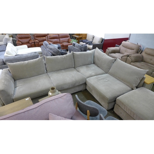 1415 - A large mink velvet upholstered corner sofa with footstool