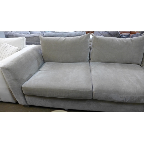 1415 - A large mink velvet upholstered corner sofa with footstool