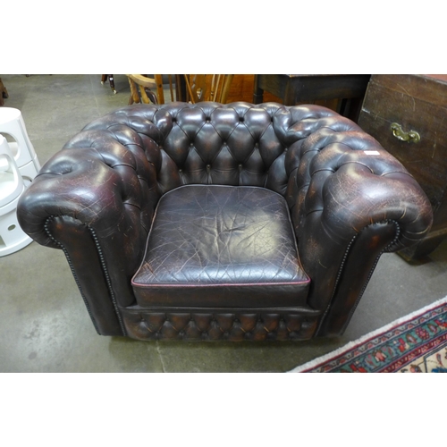 599 - A Chesterfield chestnut brown leather club chair