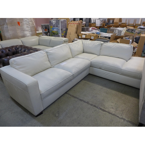 1302 - Natuzzi Two Piece Sectional Cream Leather Sofa, original RRP £1916.66 + VAT - damaged leather on bac... 