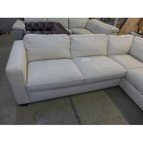 1302 - Natuzzi Two Piece Sectional Cream Leather Sofa, original RRP £1916.66 + VAT - damaged leather on bac... 