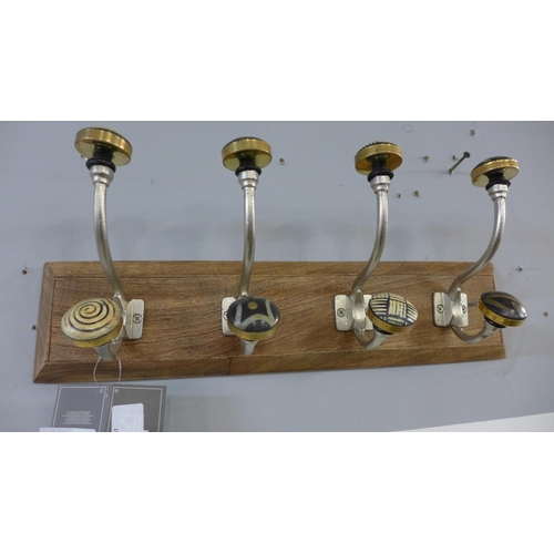 1316 - A rack of four coat hooks with ceramic knobs (HH563916)   #