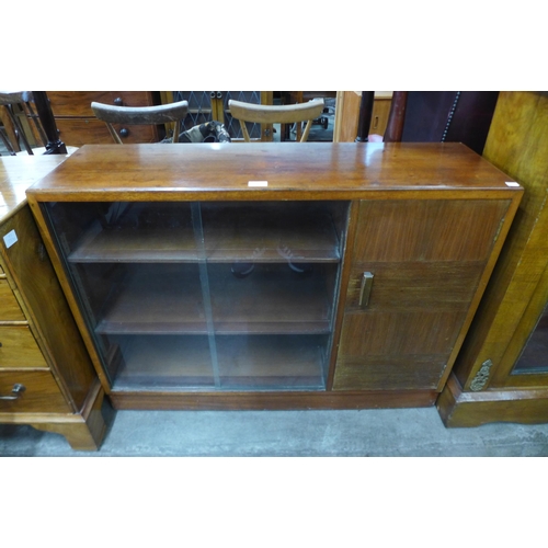 56 - A small teak bookcase