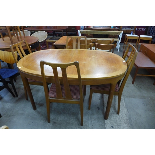 60 - A Nathan teak extending dining table and four chairs