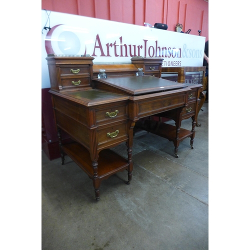 94 - A Victorian walnut and green leather topped Dickens desk, made by Charles Gregory & Co., Regent Stre... 