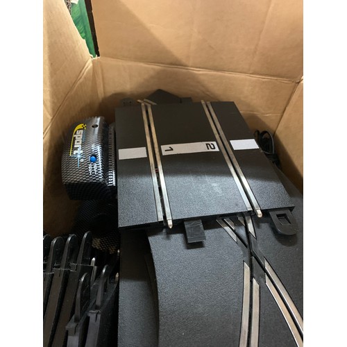 2107 - Box of Scalextric track and power supply units