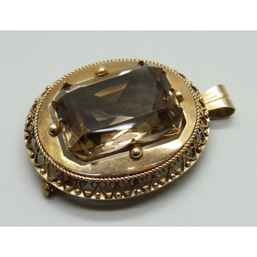 1003 - A yellow metal brooch/pendant , set with a smoky quartz stone, 26g, stone 22mm x 28mm