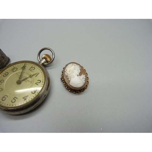 1006 - A 9ct gold cameo brooch, 6.6g, a Railway Timekeeper pocket watch, a silver thimble and a china brooc... 