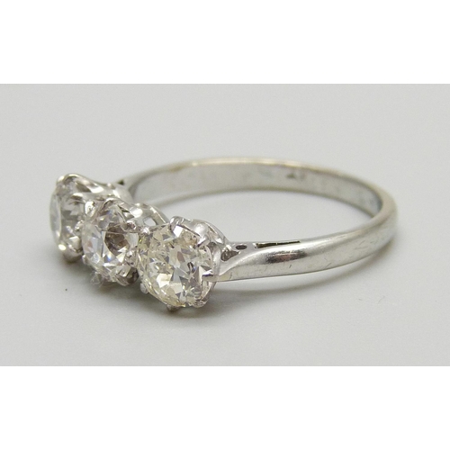 1019 - A platinum set 1930's three stone diamond ring, size O, 2.9g, diamonds circa 0.65 carat each, approx... 