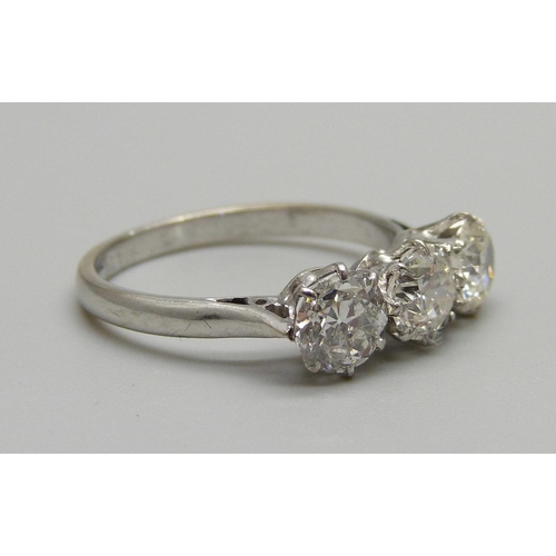 1019 - A platinum set 1930's three stone diamond ring, size O, 2.9g, diamonds circa 0.65 carat each, approx... 