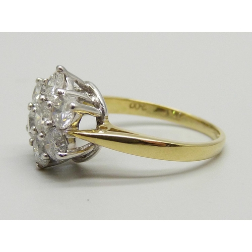 1024 - An 18ct gold seven diamond cluster ring, the shank stamped 2.00 for total carat weight, size P, 5.1g