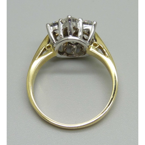 1024 - An 18ct gold seven diamond cluster ring, the shank stamped 2.00 for total carat weight, size P, 5.1g