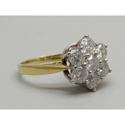 1024 - An 18ct gold seven diamond cluster ring, the shank stamped 2.00 for total carat weight, size P, 5.1g