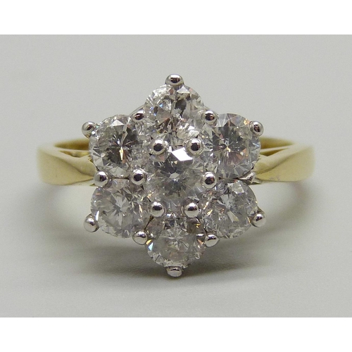 1024 - An 18ct gold seven diamond cluster ring, the shank stamped 2.00 for total carat weight, size P, 5.1g