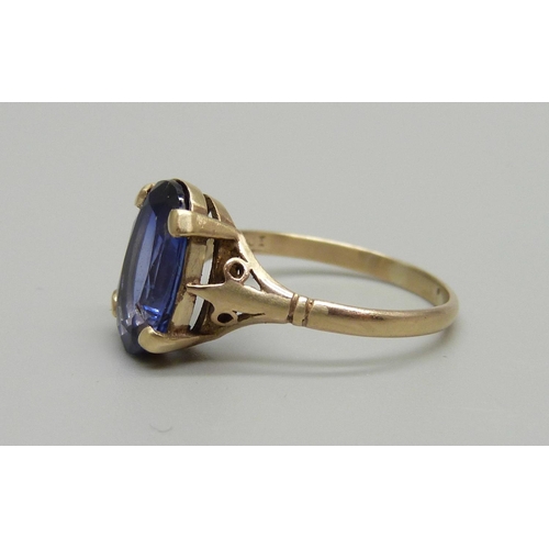 1034 - A circa 1930 pct gold dress ring set with a pale blue sapphire, (tested), size O, 2.5g, stone approx... 