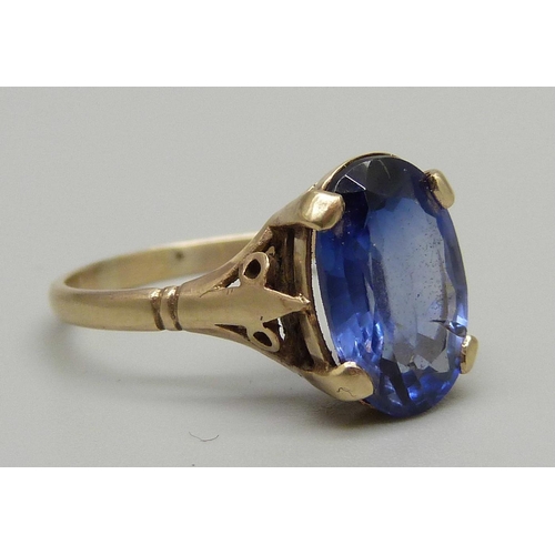 1034 - A circa 1930 pct gold dress ring set with a pale blue sapphire, (tested), size O, 2.5g, stone approx... 