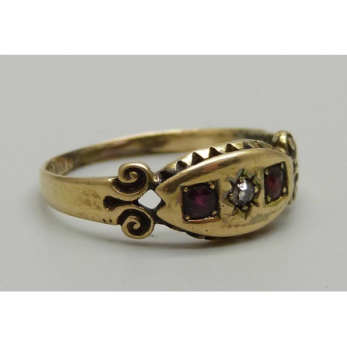 1038 - An 18ct gold, garnet and diamond ring, 2.2g, O