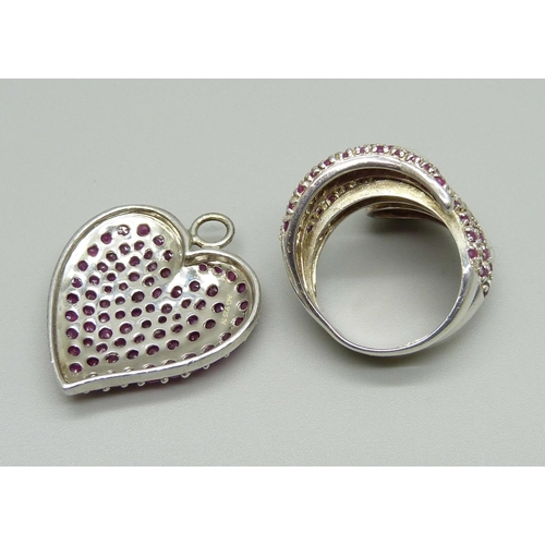 1058 - A silver and ruby snake ring and a similar heart shaped pendant, ring size P