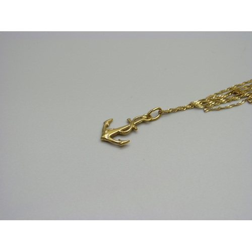 1059 - A yellow metal neck chain and anchor pendant, both marked 333, 1.6g