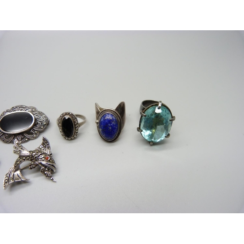 1068 - A hallmarked silver and moss agate pendant, three silver rings and four brooches