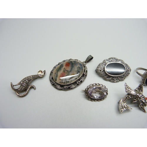 1068 - A hallmarked silver and moss agate pendant, three silver rings and four brooches