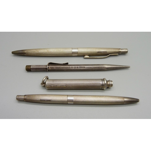 1077 - A Victorian silver propelling pencil, a silver pencil by Sampson Mordan and two silver ballpoint pen... 