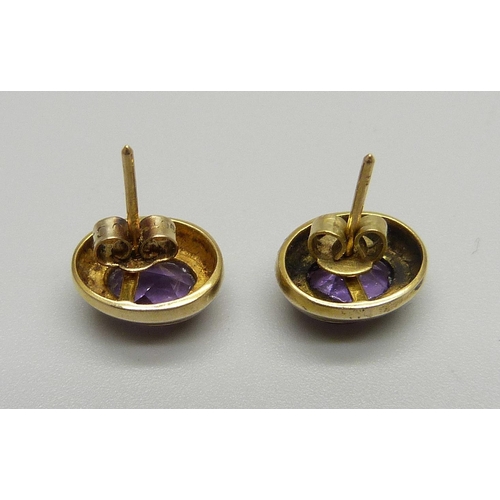 1080 - A pair of 9ct gold and amethyst ear studs, 2.9g