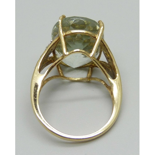 1094 - A 9ct gold blue topaz and diamond ring, 6.1g, N, stone approximately 13mm x 18mm