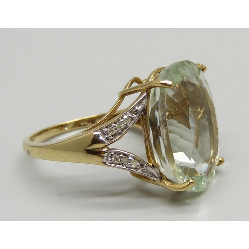 1094 - A 9ct gold blue topaz and diamond ring, 6.1g, N, stone approximately 13mm x 18mm