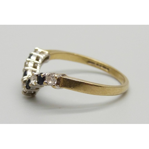 1119 - A 9ct gold, sapphire and white stone wishbone ring, 1.8g, N