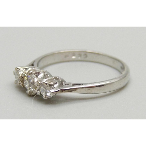 1124 - An 18ct white gold three stone diamond ring, 2.4g, J