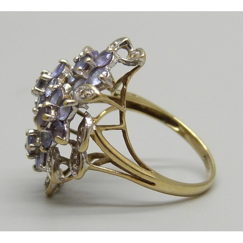 1126 - A 9ct gold diamond and tanzanite cluster ring, 3.2g, J