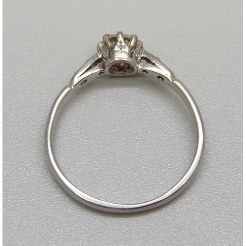 1141 - A platinum and diamond ring, main diamond approximately 0.55 carat weight, 3.1g, R