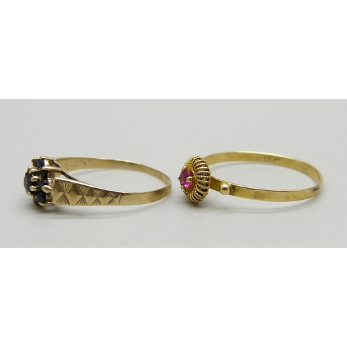 1150 - A 9ct gold cluster ring and an 18ct gold and red stone ring, 0.9g and size L and 1.1g and size O