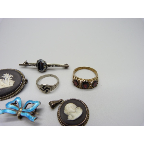 1151 - An enamelled suspender brooch, a Wedgwood set pendant and brooch, one other brooch  and three rings