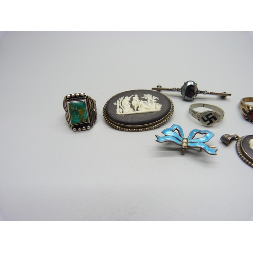 1151 - An enamelled suspender brooch, a Wedgwood set pendant and brooch, one other brooch  and three rings