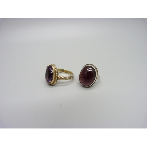 1171 - A silver and almandine garnet ring and a gilt metal amethyst ring, K and P