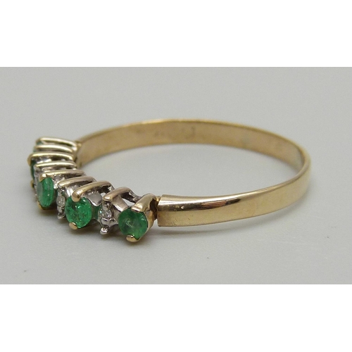 1183 - A 9ct gold diamond and emerald ring, 1.6g, S