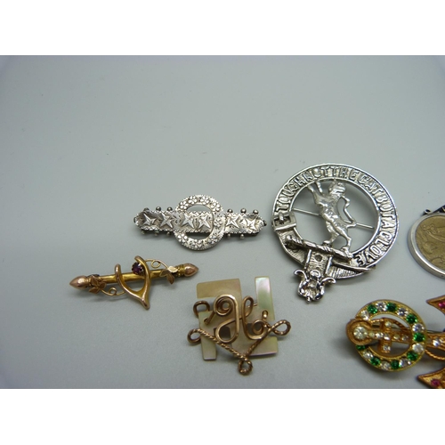 1201 - A 9ct gold horseshoe brooch, 1.4g with metal pin, a hallmarked Victorian silver brooch, an enamelled... 