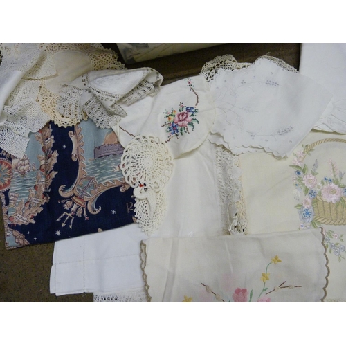 1256 - A box of linen including embroidered tablecloths and mats **PLEASE NOTE THIS LOT IS NOT ELIGIBLE FOR... 