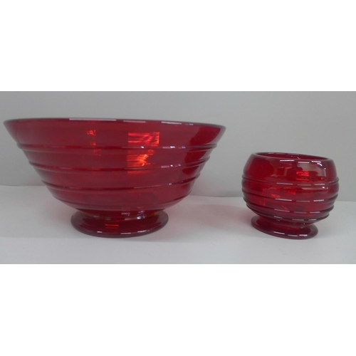 607 - Whitefriars glass ruby red bowl with ribbon trail and a similar smaller footed bowl, largest diamete... 