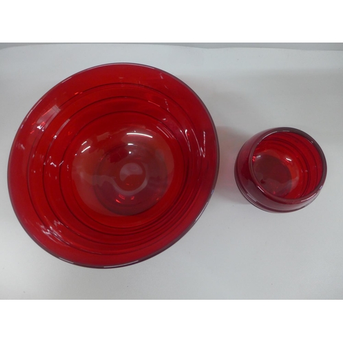 607 - Whitefriars glass ruby red bowl with ribbon trail and a similar smaller footed bowl, largest diamete... 