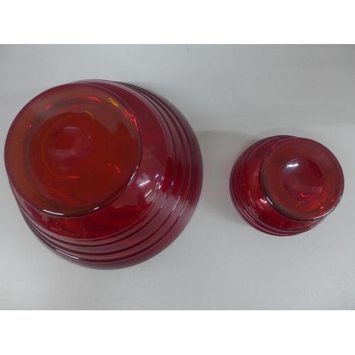 607 - Whitefriars glass ruby red bowl with ribbon trail and a similar smaller footed bowl, largest diamete... 