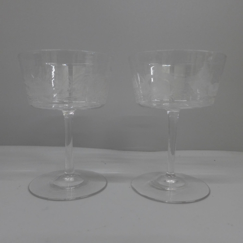 635 - A pair of circa 1890 English bucket bowled champagne glasses, acid etched with sea creatures