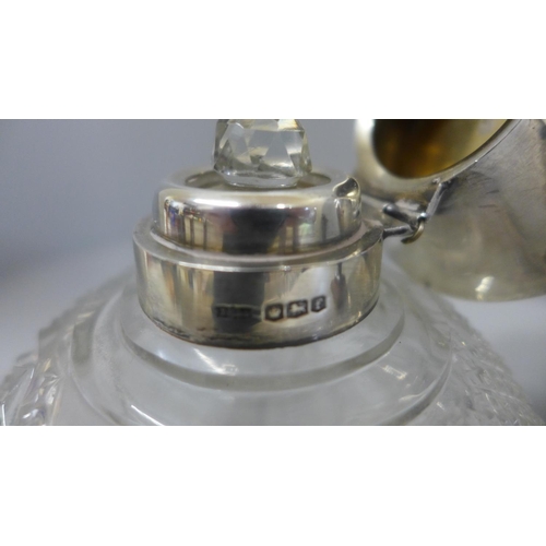 642 - A silver topped glass scent bottle, hinge a/f, a dish marked 24K GP and a metal model of a bear, Ber... 