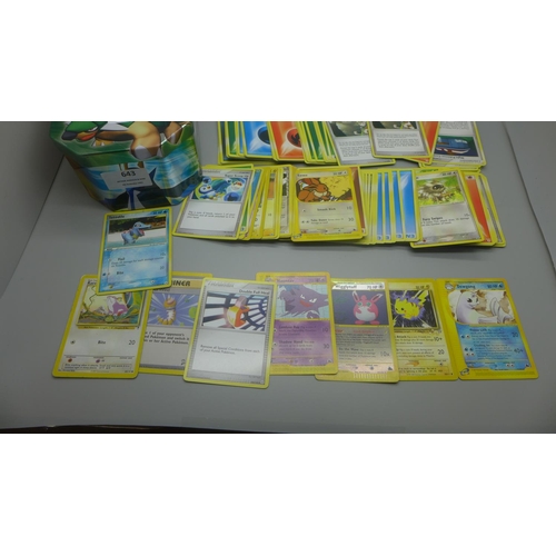 643 - 140 Pokemon cards including, Skyridge set, Neo Genesis set and Hidden Legends set in collectors tin