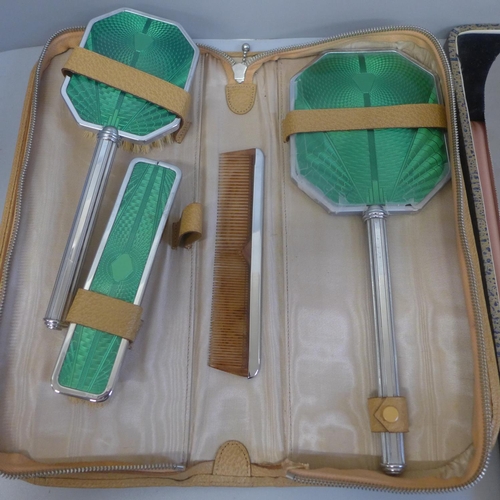 677 - A vanity set, cased and a carving set, boxed