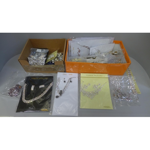 684 - Two boxes of costume jewellery, lncluding large butterfly brooches and carded necklace sets