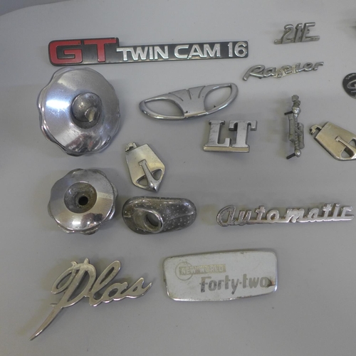 701 - A collection of car badges